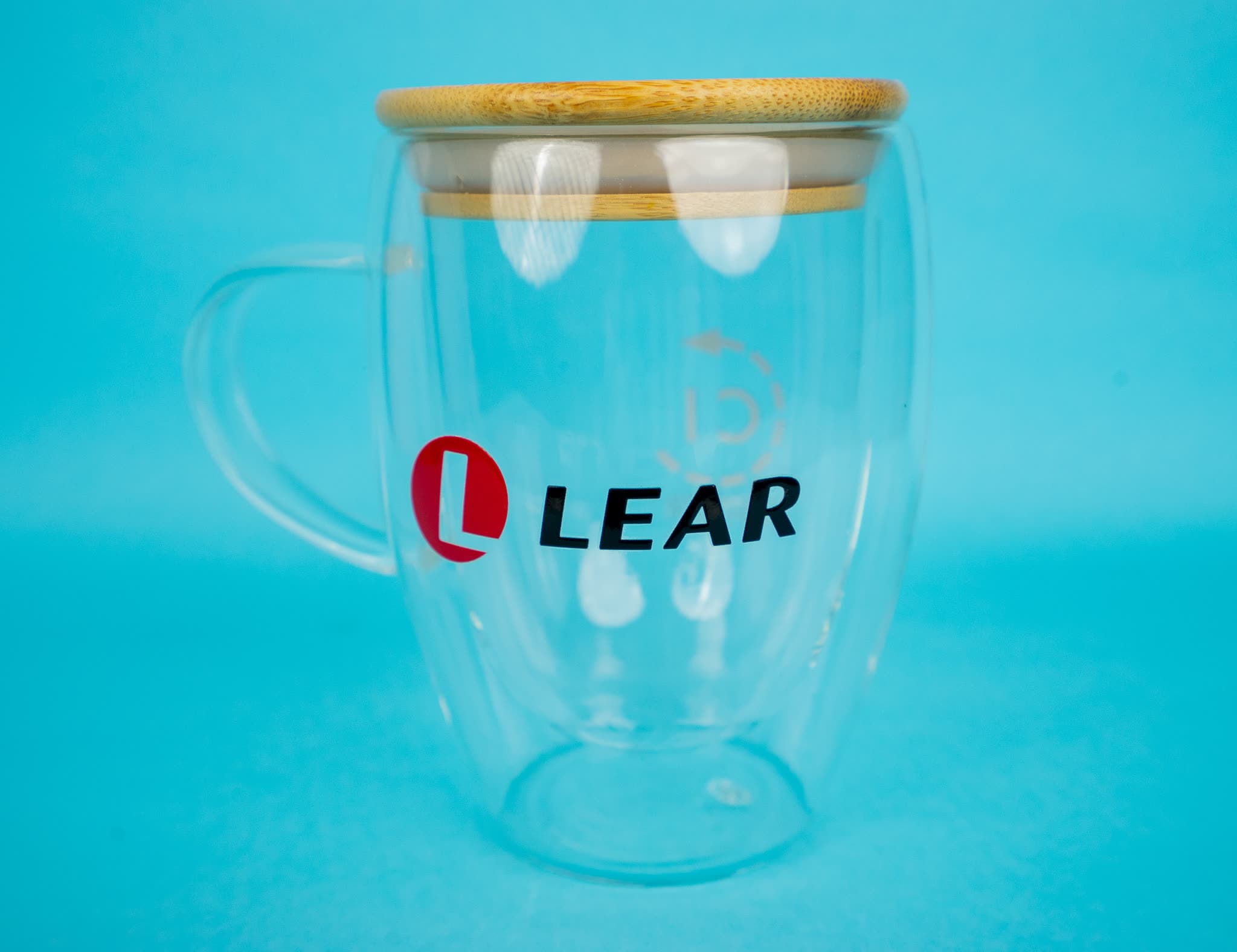Double-walled glass mug with a bamboo lid, printed with a corporate logo