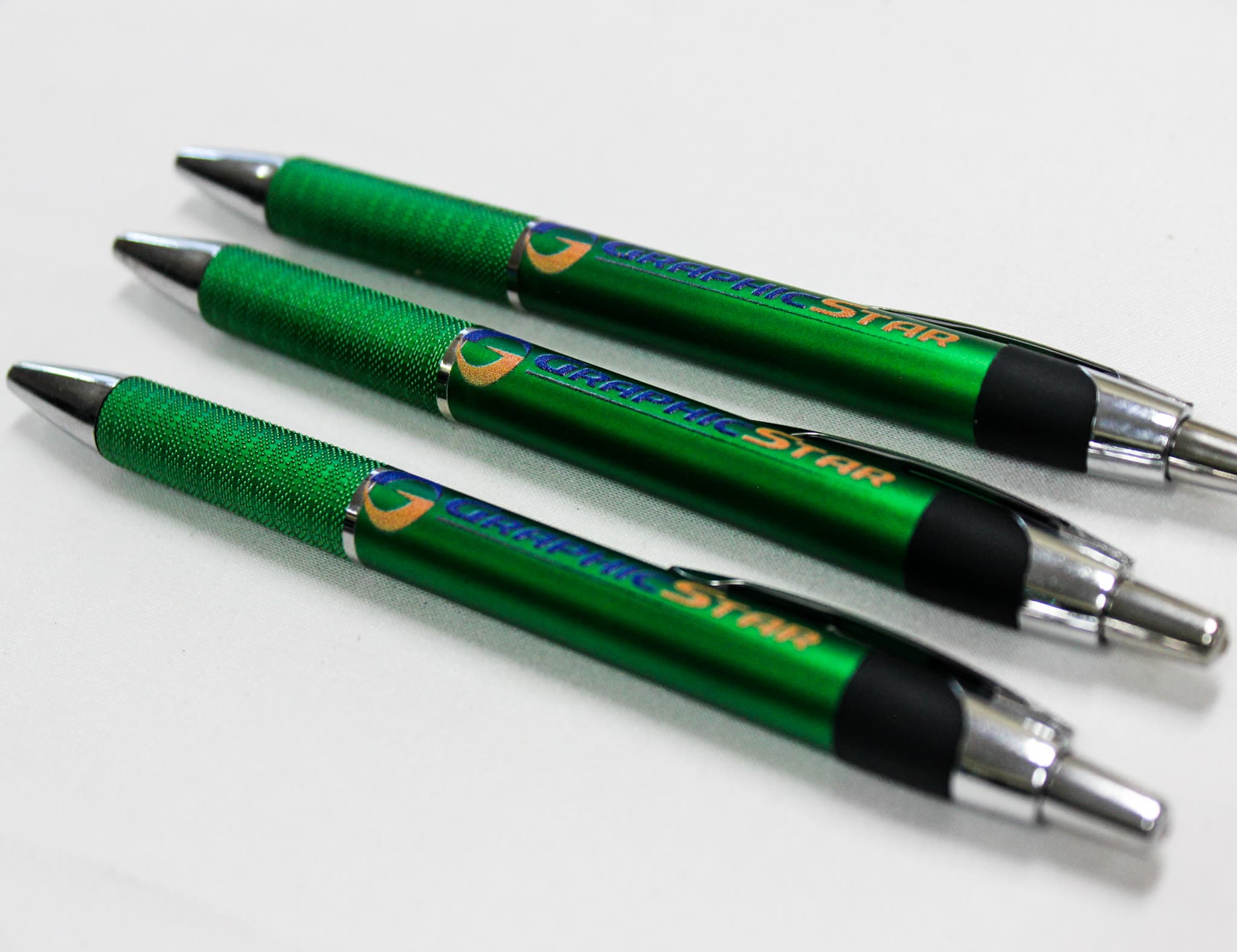 Three branded ballpoint pens printed with the Cebu GraphicStar logo
